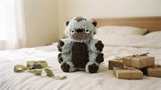 A Curvite plush on a cream linen bed beside wrapped kraft-paper gifts